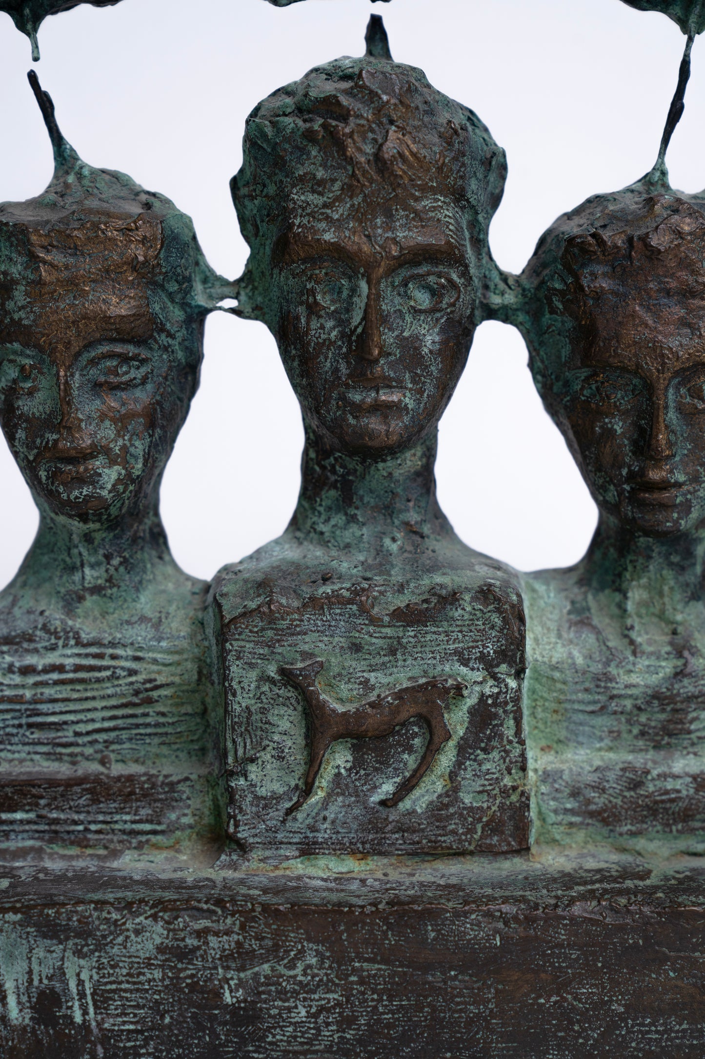 Three faces sculpture
