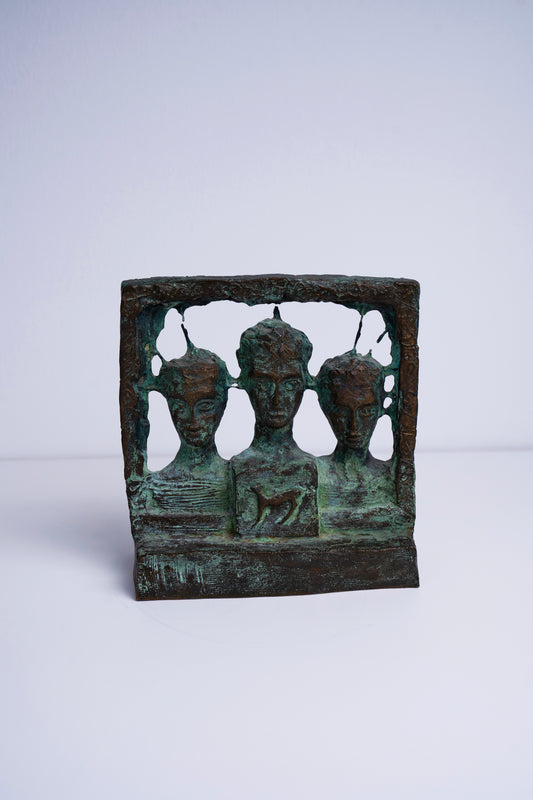 Three faces sculpture